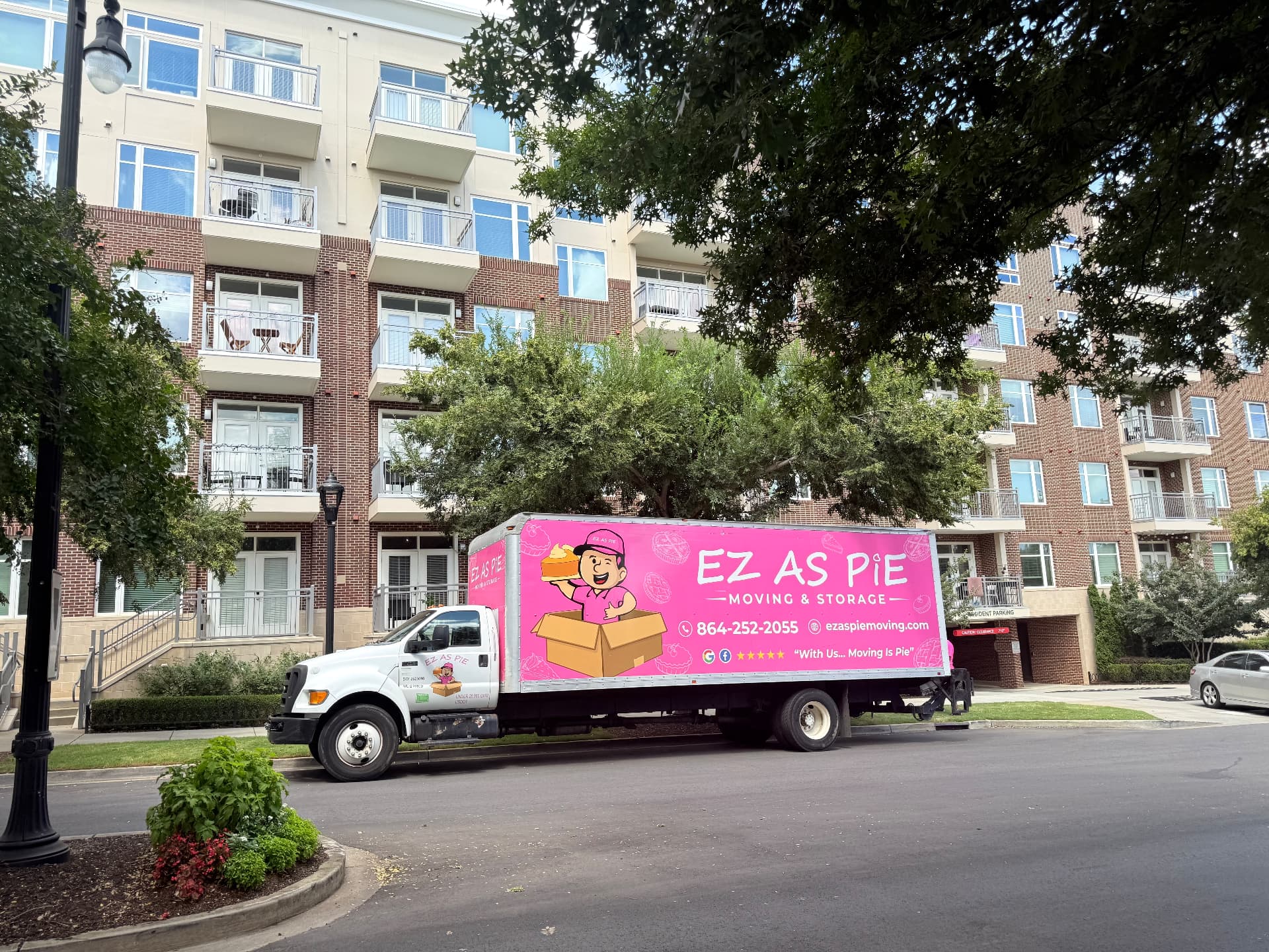 EZ As Pie crew moving furniture into a Greenville apartment building