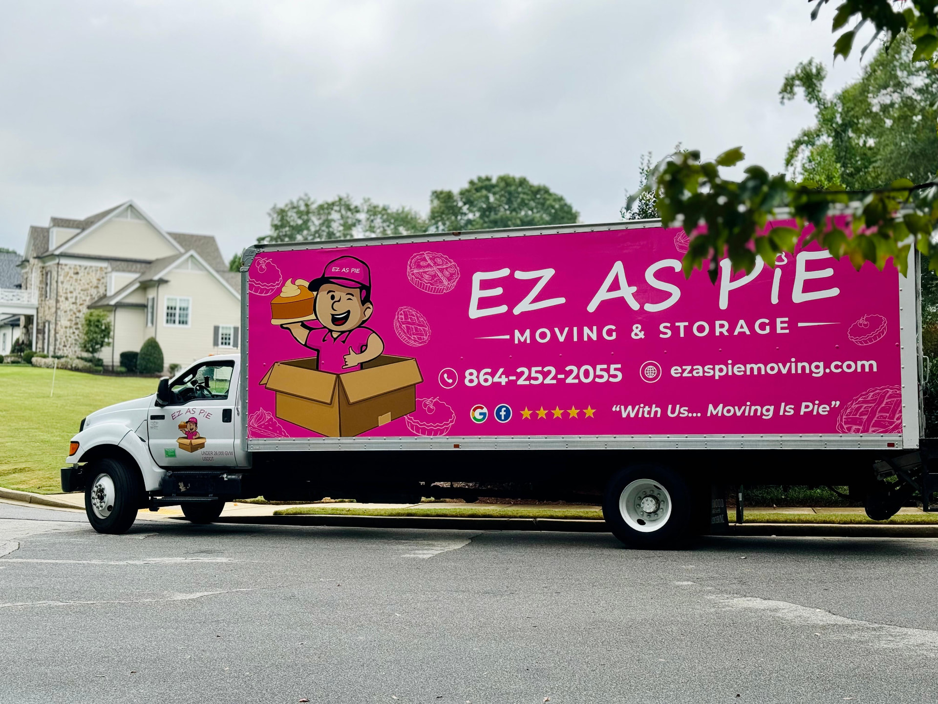 EZ As Pie pink moving truck parked outside an Upstate home